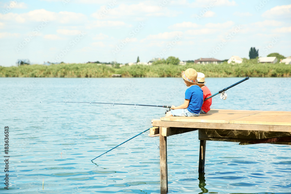 Cute children fishing on summer day Cute children fishing on summer day