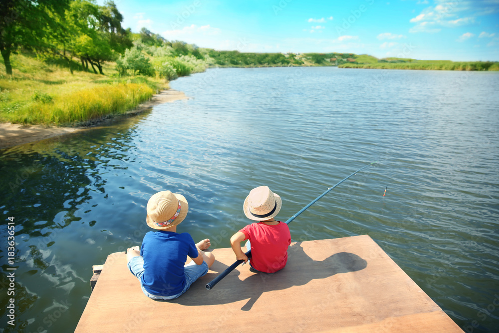 Fototapeta premium Cute children fishing on summer day