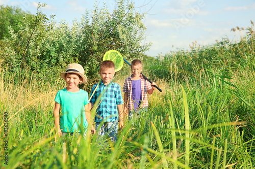 Cute boys going fishing on summer day photo