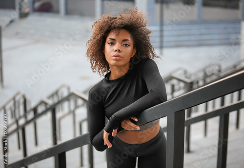 Принти на полотні Beautiful African American woman in sportswear outdoors
