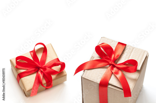 Gift boxes, tied with red ribbons. Festive packaging wallpaper.  © Sun-flower