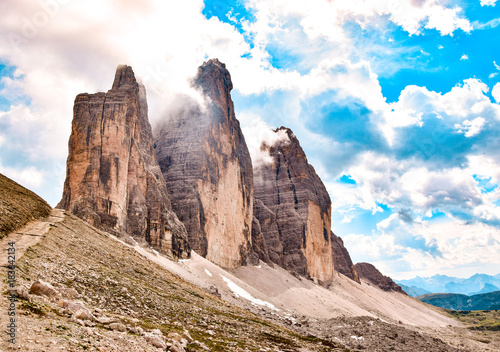 Unique mountains on a cloudy climbing day. Stony way.