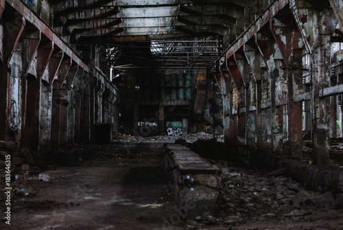 Old abandoned ruined factory, inner large hall