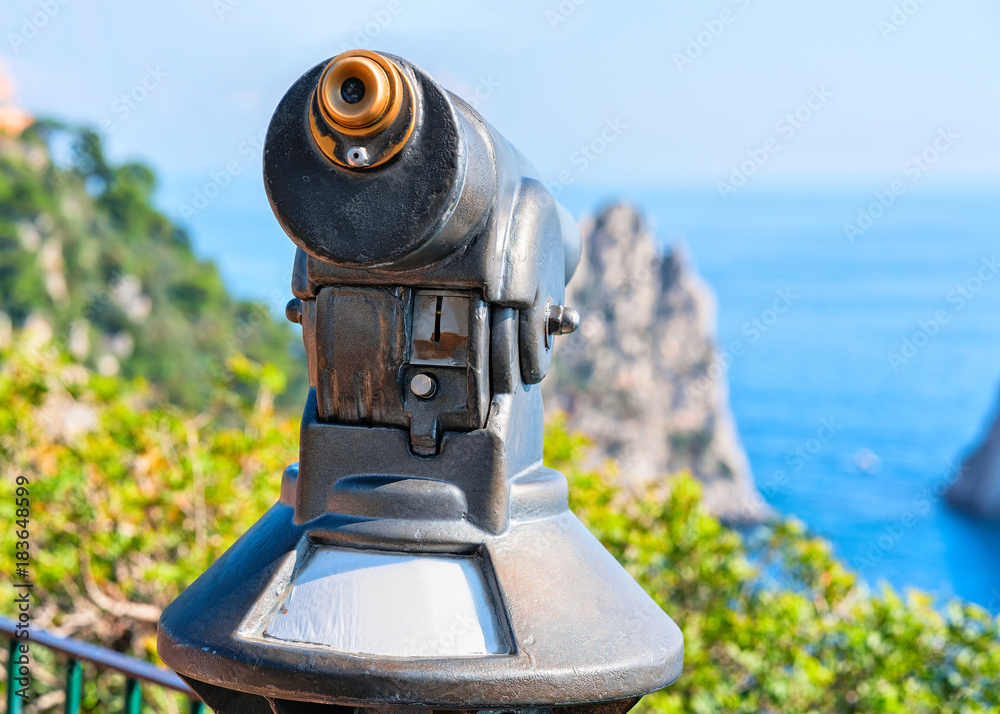 Telescope at Faraglioni in Tyrrhenian Sea in Capri Island