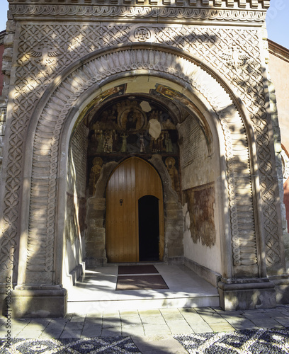 Entrance with fresco paintings in Zica  13th century orthodox monastery in Serbia