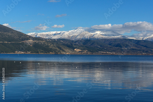 Amazing panoramic Landscape of Lake Pamvotida, Pindus mountain and city of Ioannina, Epirus, Greece © Stoyan Haytov