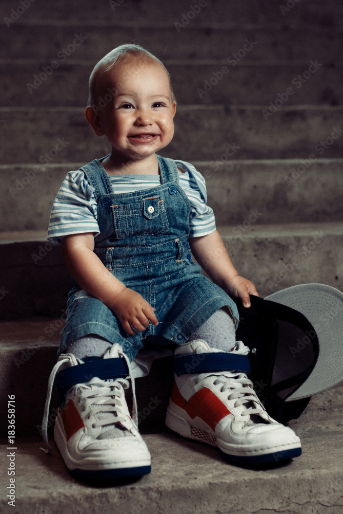 little boy in large sneakers and big hat .Hip-Hop Style. fashion children.  Young Rapper. 1 years old Stock Photo | Adobe Stock