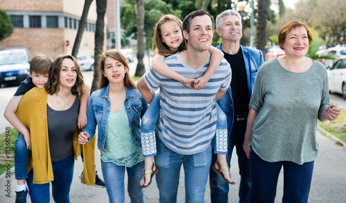 Friendly family going in the park together