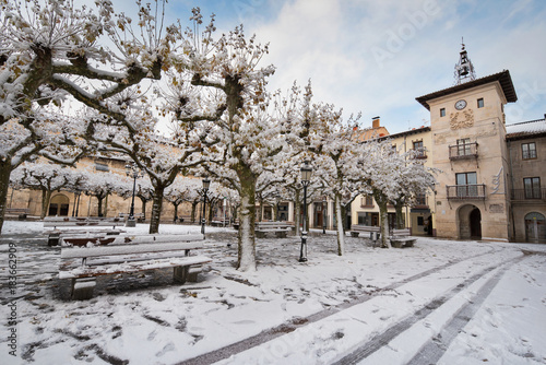 Winter scene of a snowed cityscape landscape of the ancient village of Briviesca in Burgos Province, Castilla y Leon, Spain.