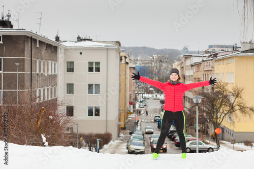Fototapeta Naklejka Na Ścianę i Meble -  Woman wearing sportswear urban exercising outside during winter