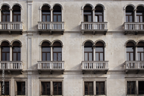 View of a facade of old, historical building in Venice. The image reflects architectural style of region. © theendup