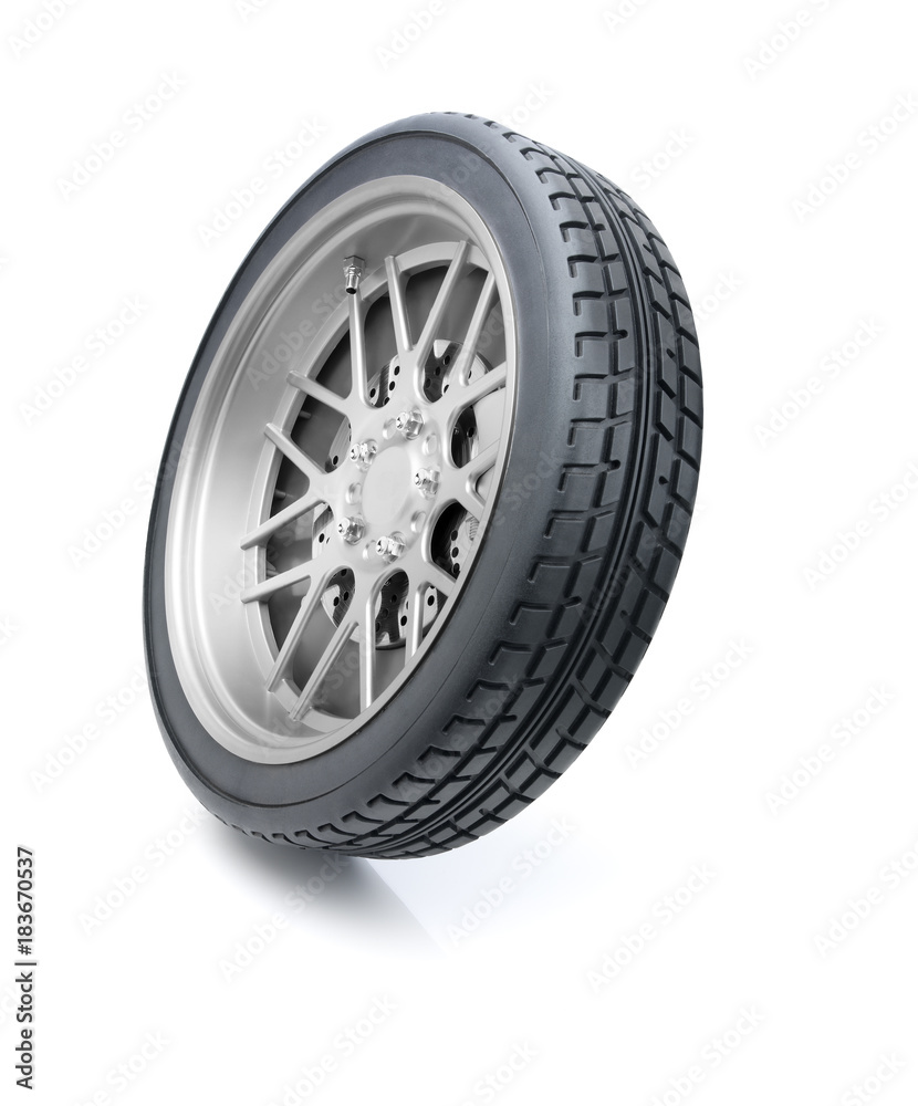 Car wheel tilted in motion against white background. Clipping path