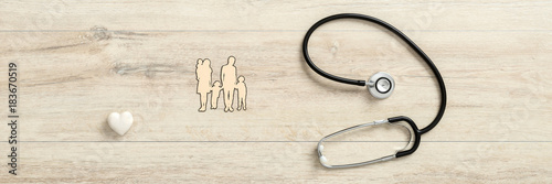 White heart with medical stethoscope next to  a family
