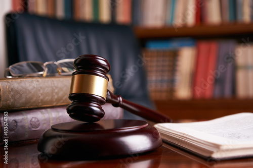 Judge's Gavel or mallet on wooden table