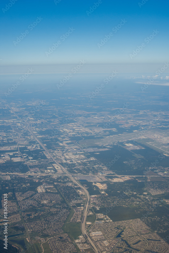 Metropolis Area of Houston, Texas Suburbs from Above in an Airplane Metropolis Area of Houston, Texas Suburbs from Above in an Airplane