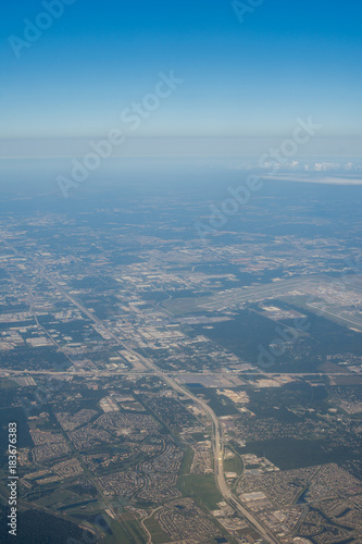 Metropolis Area of Houston, Texas Suburbs from Above in an Airplane © Christian Hinkle