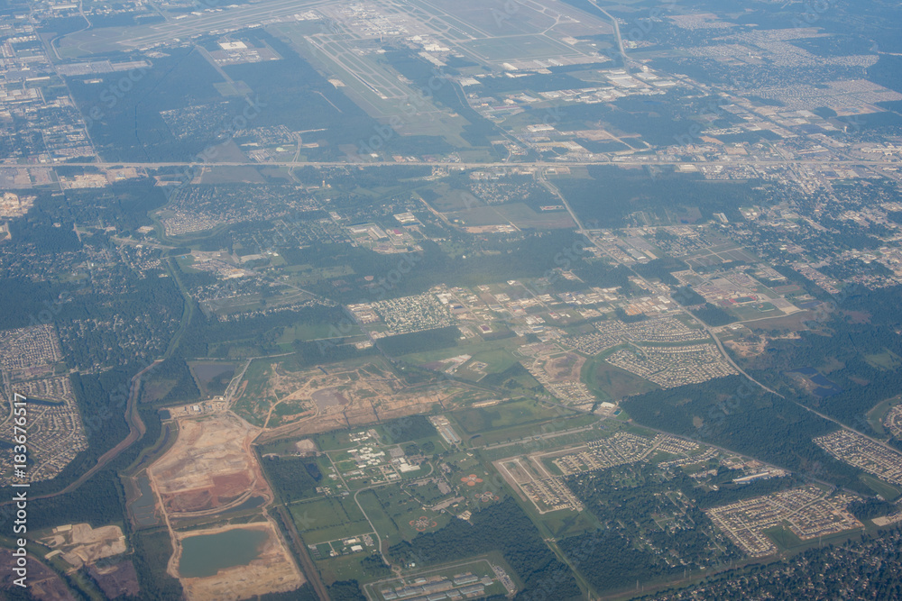 Metropolis Area of Houston, Texas Suburbs from Above in an Airplane