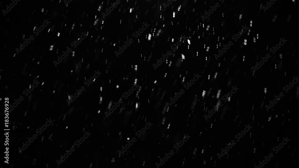 Glowing particles of snow flying in the air sparks color dark monochrome background light Christmas overlay