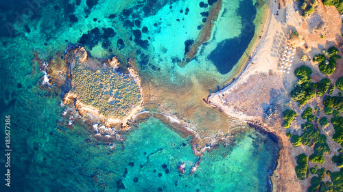 Autumn 2017: Aerial bird's eye view photo taken by drone depicting beautiful deep blue - turquoise waters and rocky seascape
