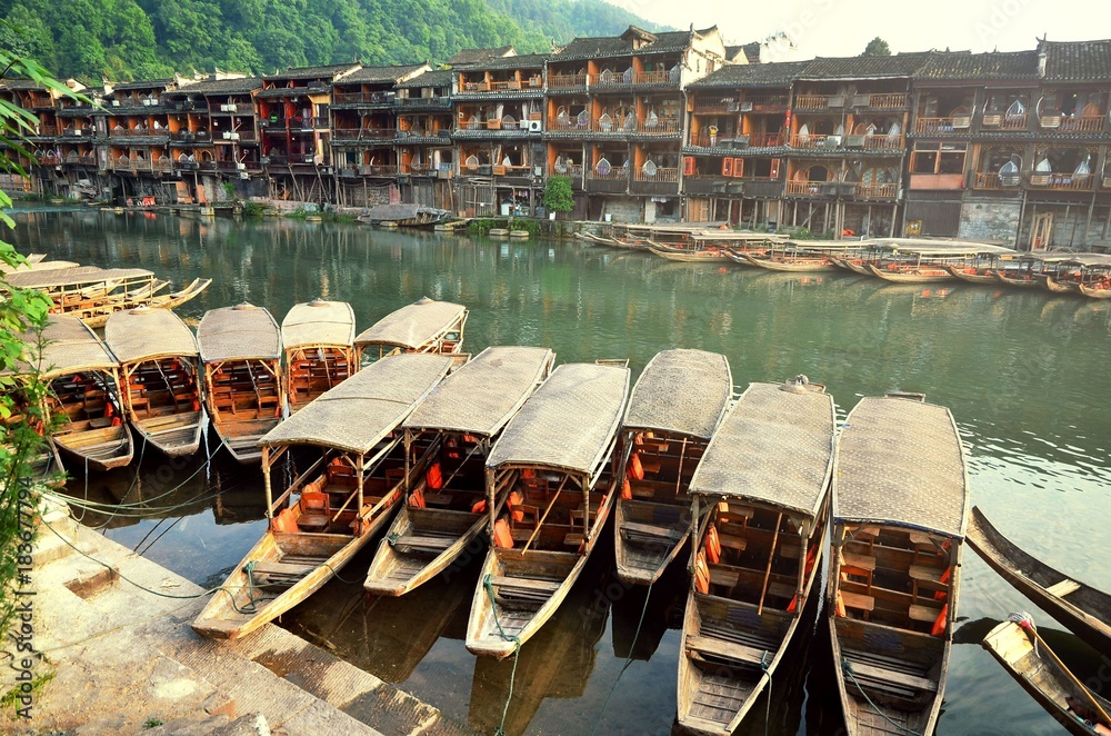 boats around riverside at the Phoenix Hong Bridge in Fenghuang