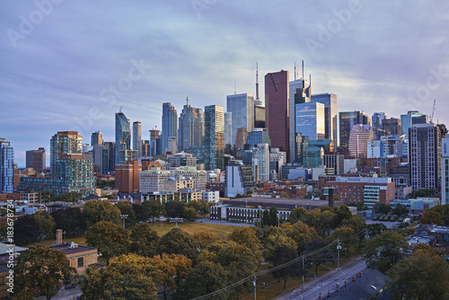 Toronto Skyline in autumn - Facades and rooftops of skyscrapers in the  Financial District of Toronto at sunset © redfoxca