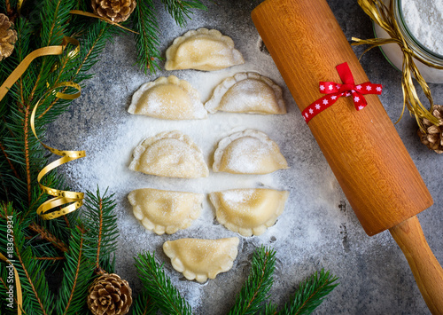 Christmas dumplings with decoration on a grey board. Top view.