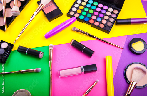 Decorative cosmetic set on colorful background