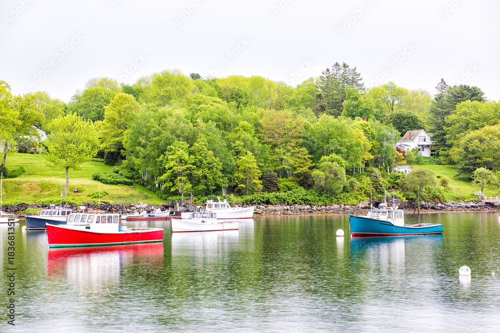 Empty marina harbor in small village in Maine during rain with boats Empty marina harbor in small village in Maine during rain with boats