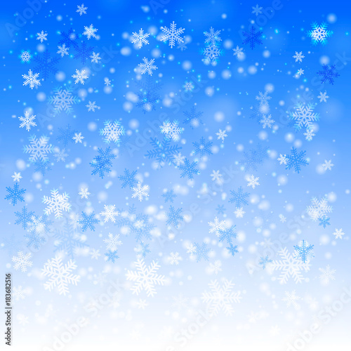 Light blue winter background with snowflakes.