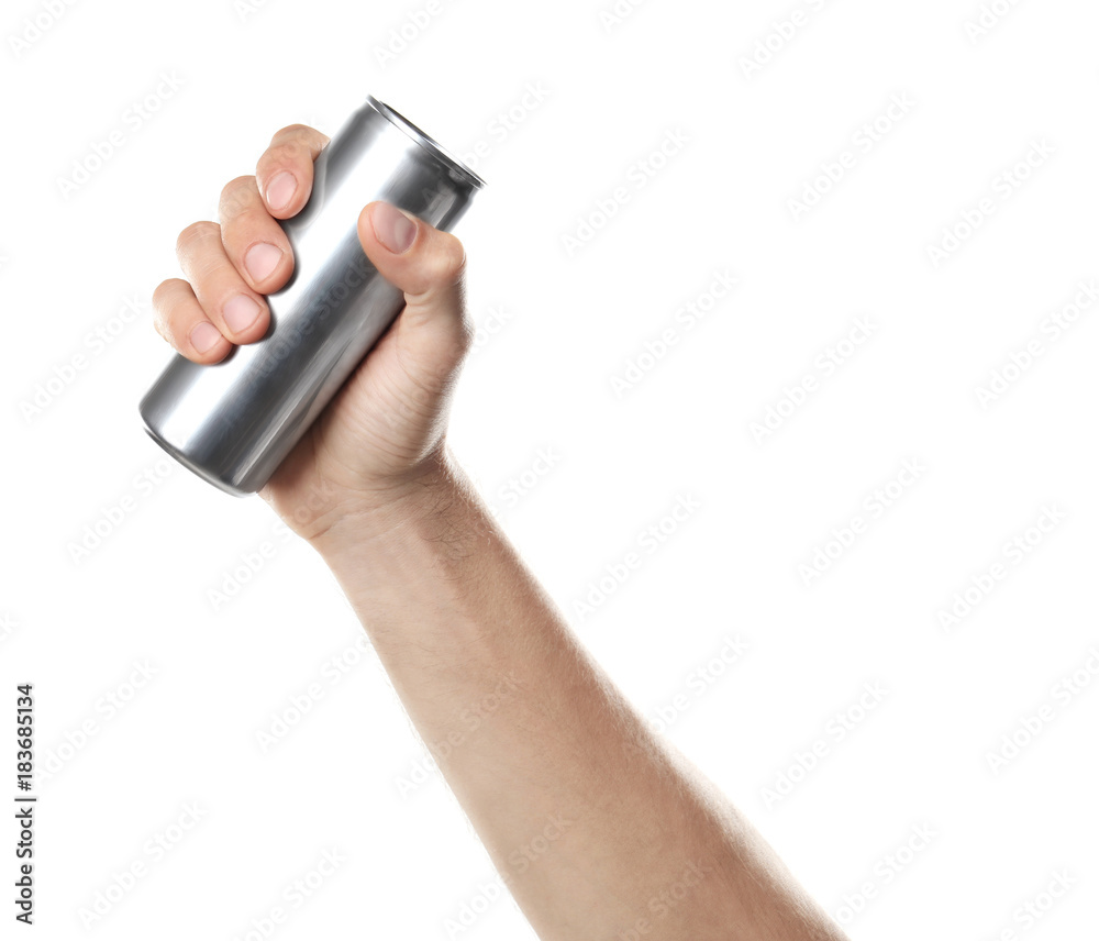 Young man holding aluminum can against white background