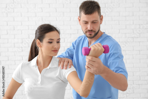 Physiotherapist working wit...