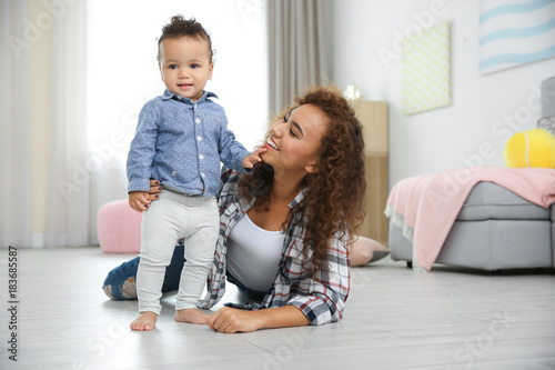 Cute baby and young mother ...