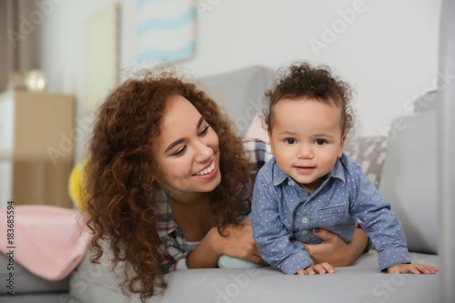 Cute baby and young mother ...