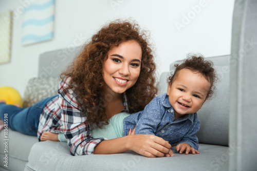 Cute baby and young mother ...