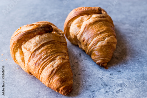 Freshly Baked Croissants on Blue Surface.