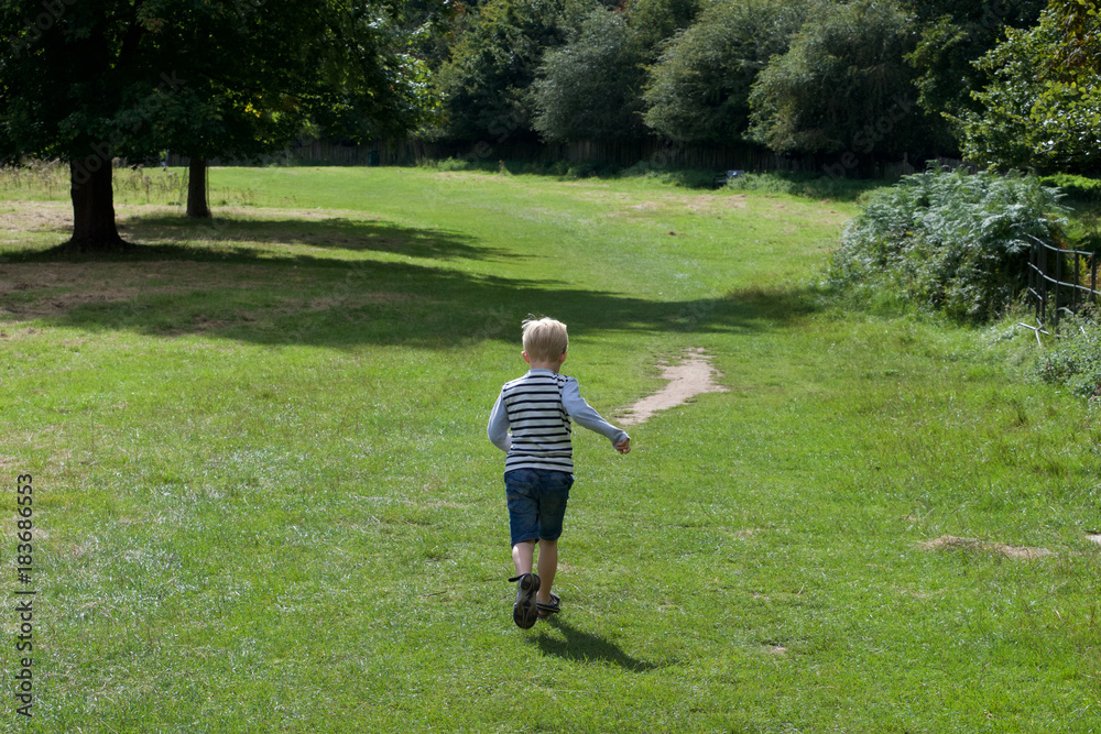 Boy running on grass Boy running on grass