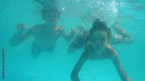 Wallpaper Mural Two boys swimming under water in the pool slow motion Torontodigital.ca