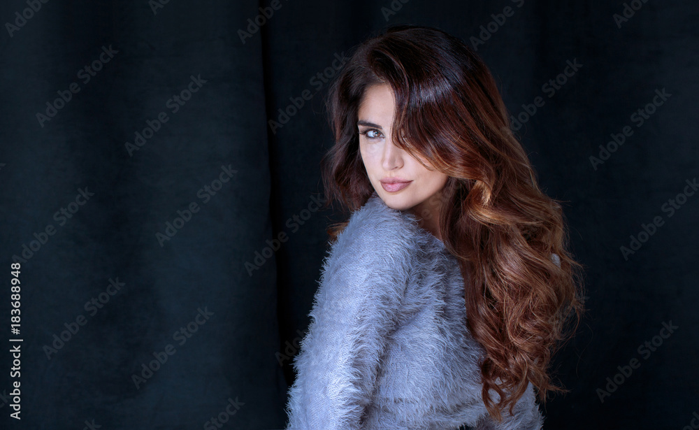 Beautiful lady with long curly hairstyle posing. Beautiful lady with long curly hairstyle posing.