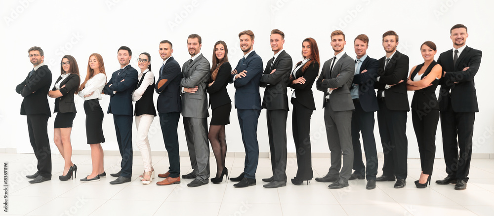large business team standing arms crossed in front