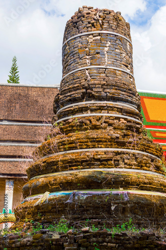 ncient stupa near the temple in Thailand photo