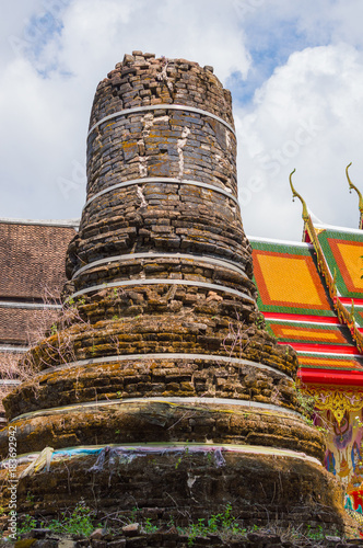  ncient stupa near the temple in Thailand photo
