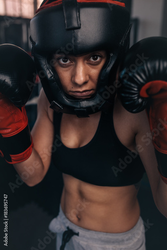 Female boxer geared up for a bout