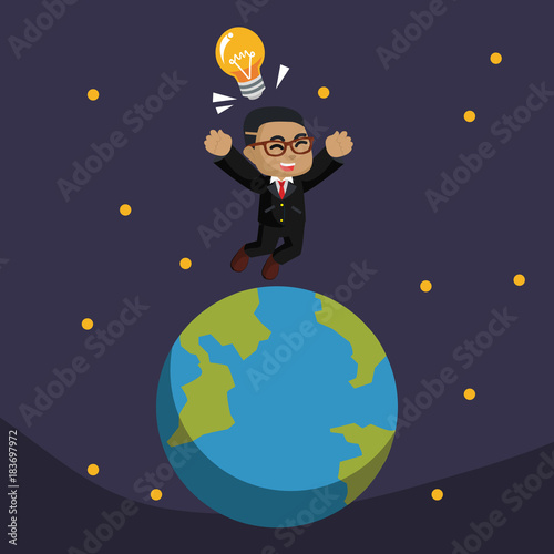 African businessman jumping on earth