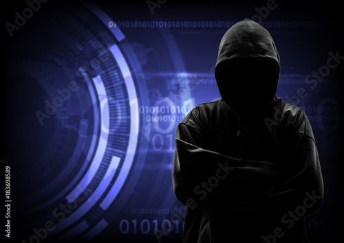 Hooded computer hacker stealing information