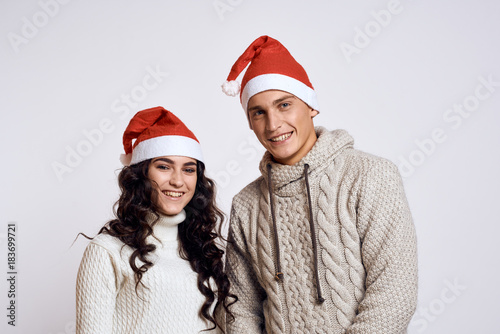 a couple smiling on a light background  new year  christmas  holiday