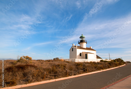 OLD POINT LOMA LIGHTHOUSE AND MUSEUM AT CABRILLO NATIONAL MONUMENT UNDER BLUE CIRRUS CLOUDS AT POINT LOMA SAN DIEGO CALIFORNIA UNITED STATES