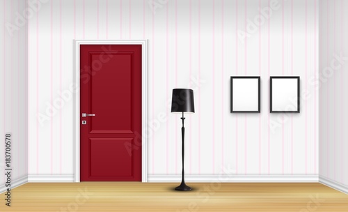 Closed red door with floor lamp and frames on striped wall background
