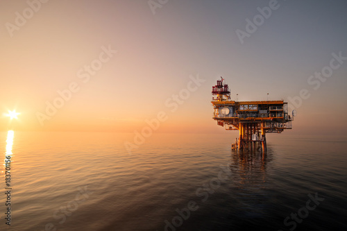Sunset time,Offshore construction platform for production oil and gas, Oil and gas industry and hard work, Production platform and operation process by manual and auto function © xmentoys