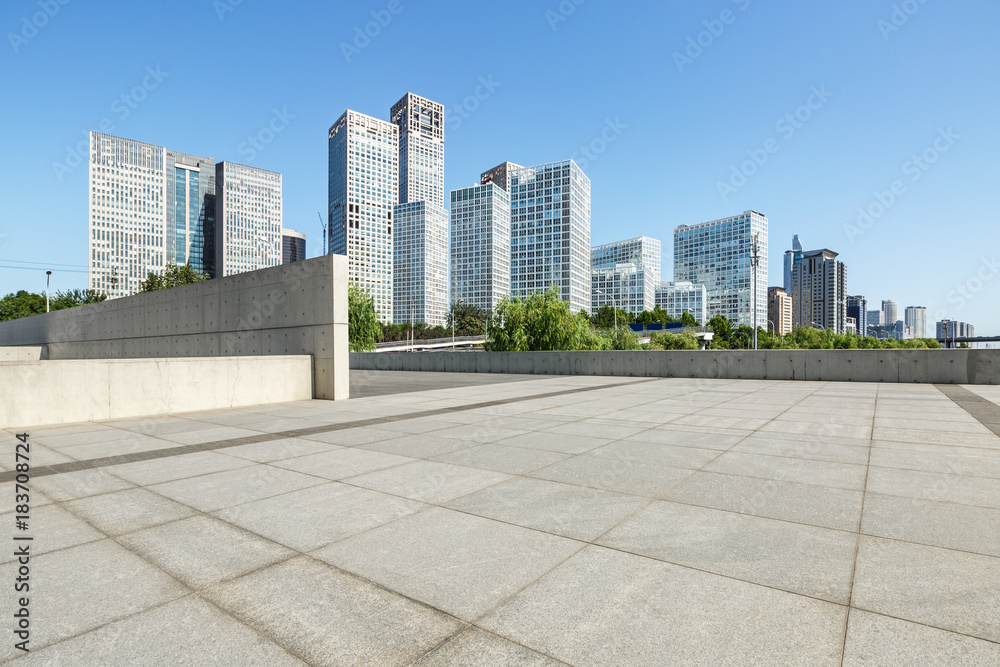 Empty city square floor and modern city commercial buildings scenery