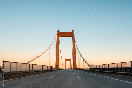 A bridge between Denmark and Sweden early in an autumn morning. A Danish-Swedish detective series of the same name is connected with this bridge. The picture is taken in direction of Denmark.